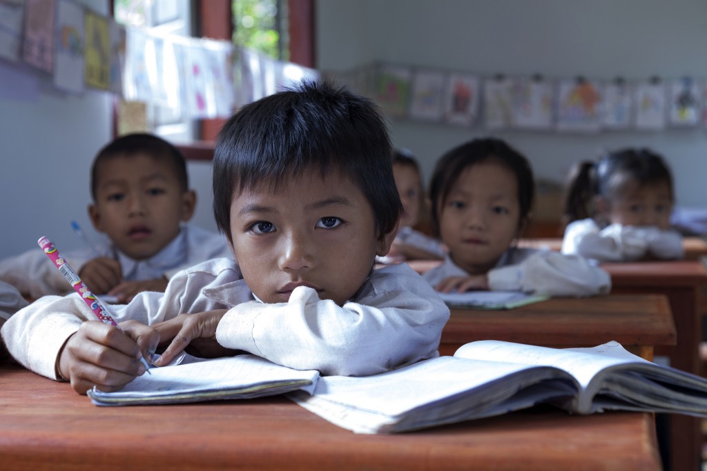 Primary school students in Oudomxay province, Laos. Photo by World Bank, Flickr, taken 16 November 2012. Licensed under CC BY-NC-ND 2.0.